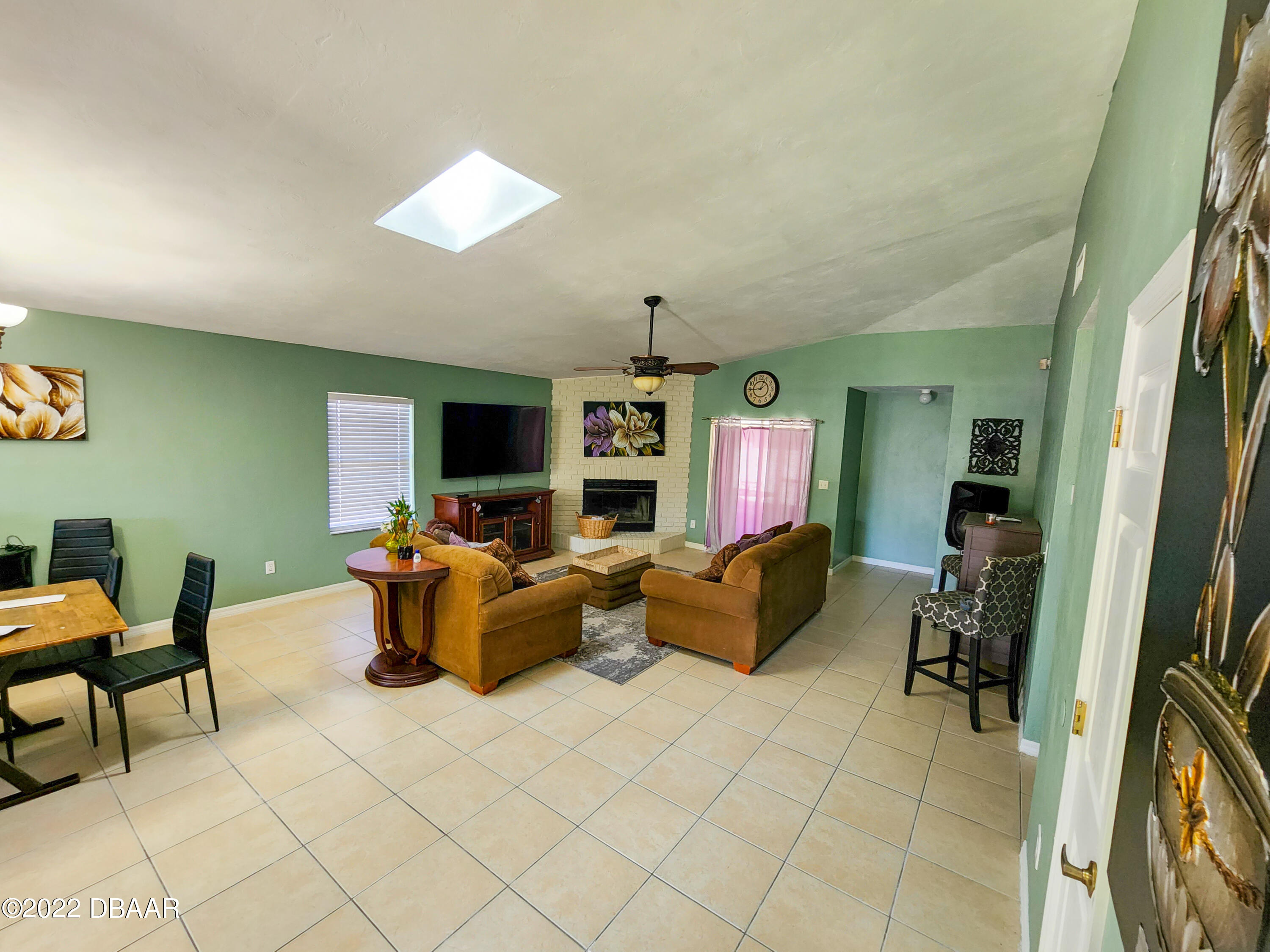 1467 Bay Grove Drive Port Orange, FL 32129 - Photo 9 of 35 a living room with furniture and a flat screen tv