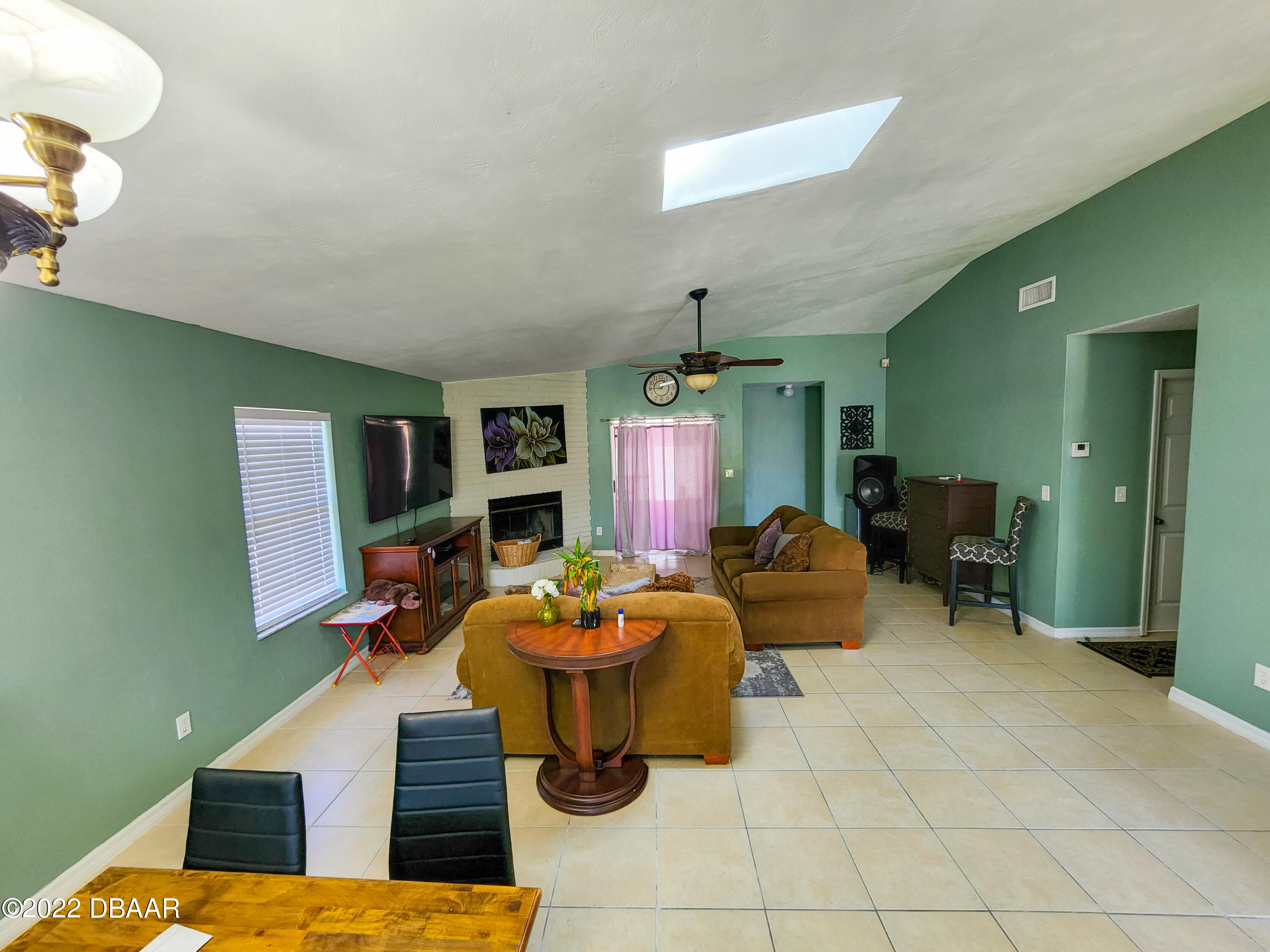 1467 Bay Grove Drive Port Orange, FL 32129 - Photo 10 of 35 a living room with furniture and a potted plant