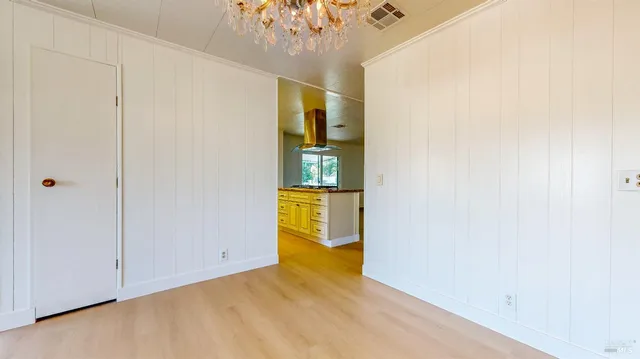 a kitchen with stainless steel appliances granite countertop a sink and a stove