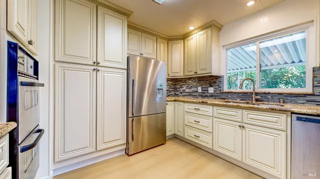 a view of a kitchen with wooden floor and a kitchen