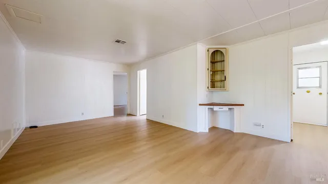 a bathroom with a sink mirror and toilet