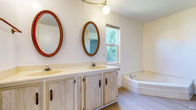 a view of a patio with table and chairs and potted plants