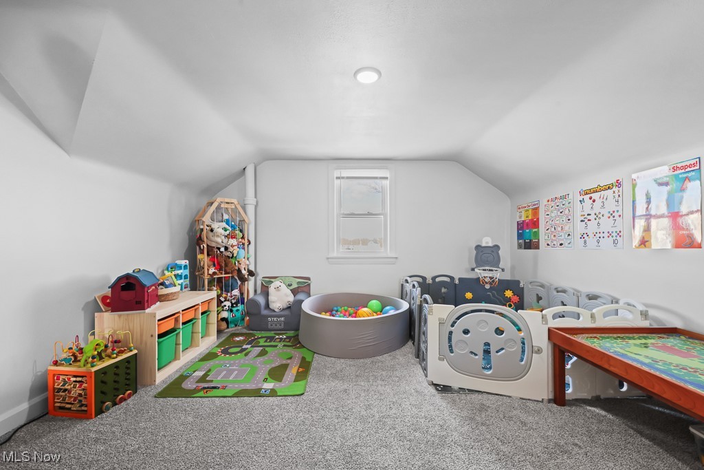 4722 Navarre Road Southwest Canton, OH 44706 - Photo 25 of 38 Rec room with vaulted ceiling and carpet floors