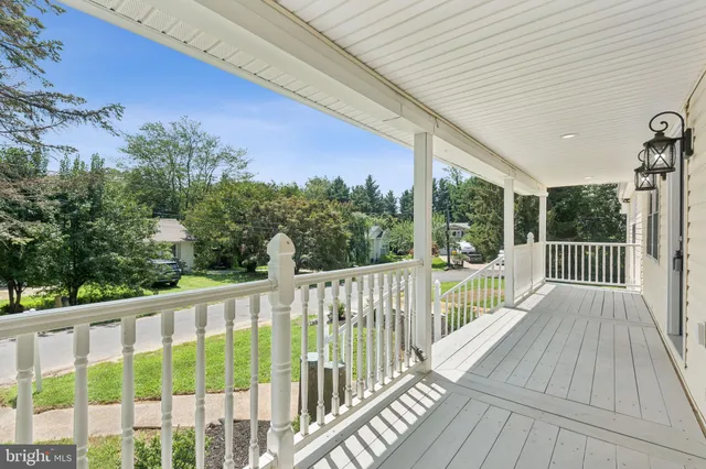 a view of a balcony with wooden floor