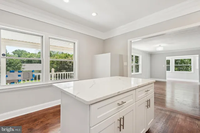 a kitchen with a stove and a kitchen island