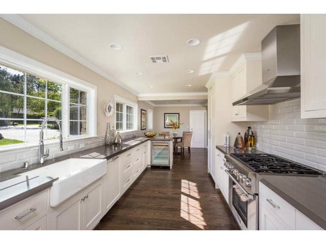 324 Darrell Road Hillsborough, CA 94010 - Photo 4 of 16 a large kitchen with stainless steel appliances granite countertop a lot of counter space and a sink