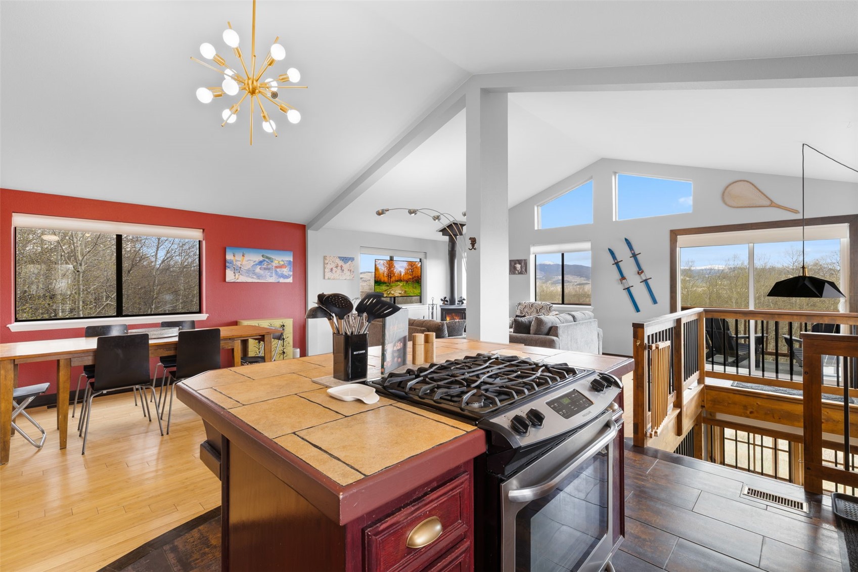 2349 Michigan Hill Road Jefferson, CO 80456 - Photo 11 of 33 a kitchen with a stove a sink and a dining table