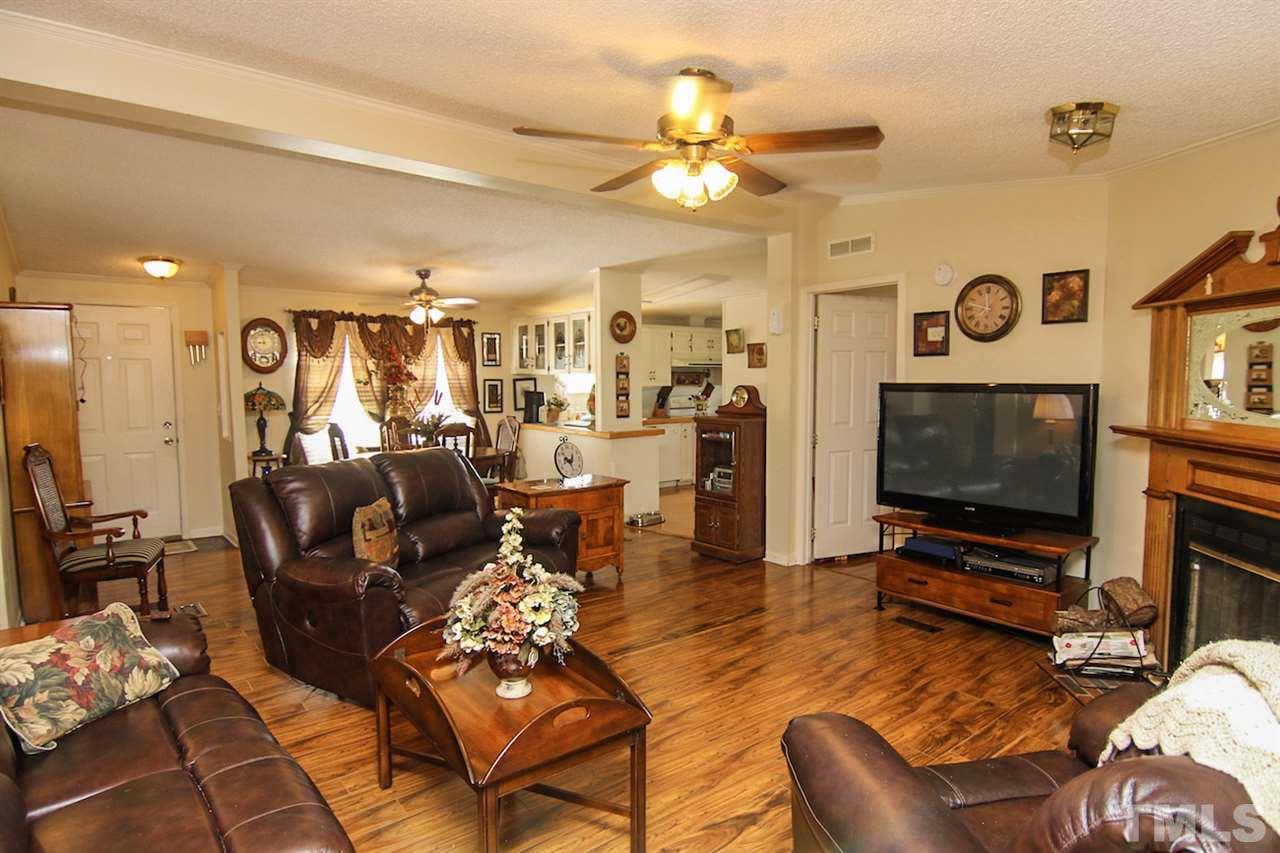 5699 Elevation Road Benson, NC 27504 - Photo 7 of 24 a living room with furniture and a flat screen tv