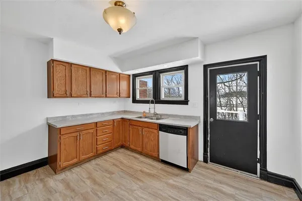 a kitchen with stainless steel appliances granite countertop a stove and a sink
