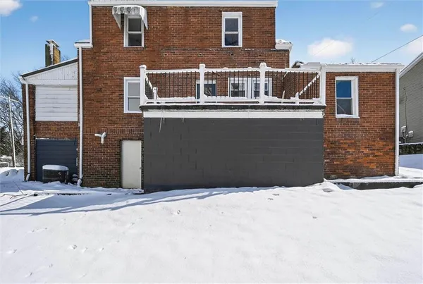 a view of a building with a snow on the road