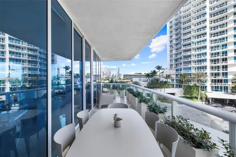 a view of balcony with furniture