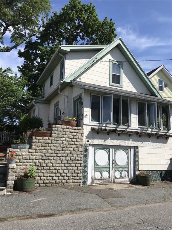 a front view of a house with garage