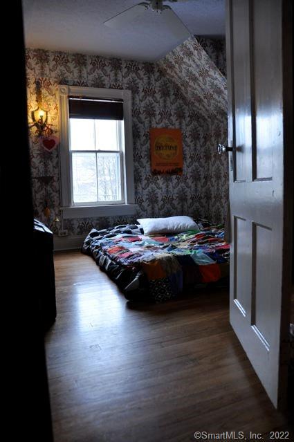 1 Cottage Street Norwalk, CT 06855 - Photo 7 of 7 a bedroom with a bed and a large window