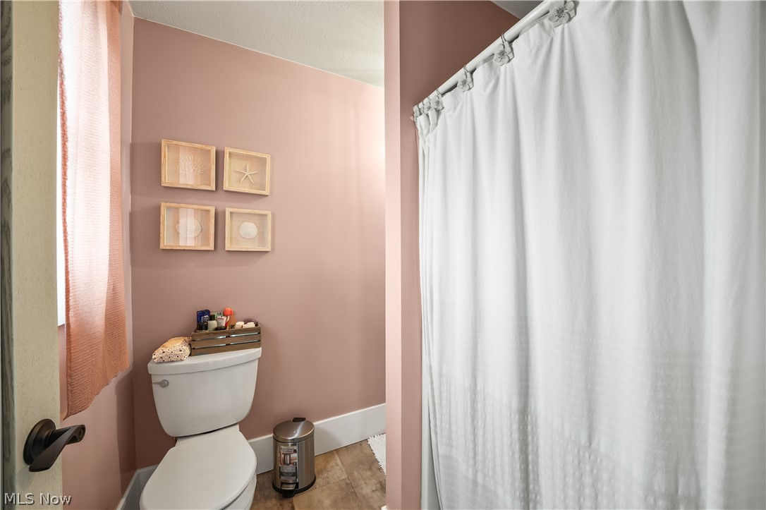 9561 Creaser Road North Bloomfield, OH 44450 - Photo 13 of 45 Full bathroom featuring a shower with shower curtain