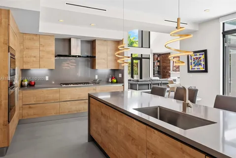 a kitchen with lots of clutter and cabinets