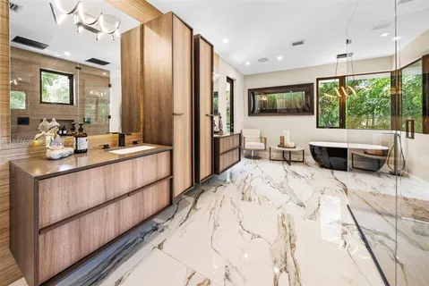 a kitchen with a wooden floor and a refrigerator