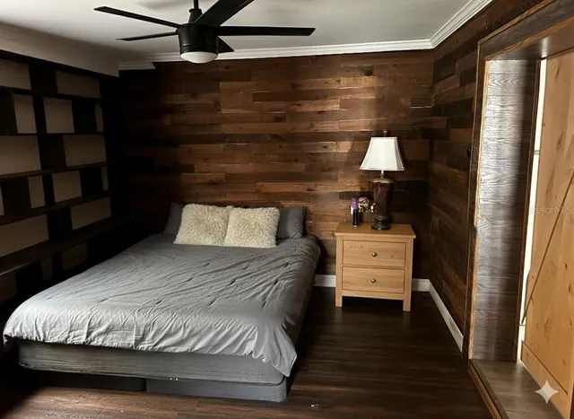 a bathroom with a sink a toilet a mirror and shower