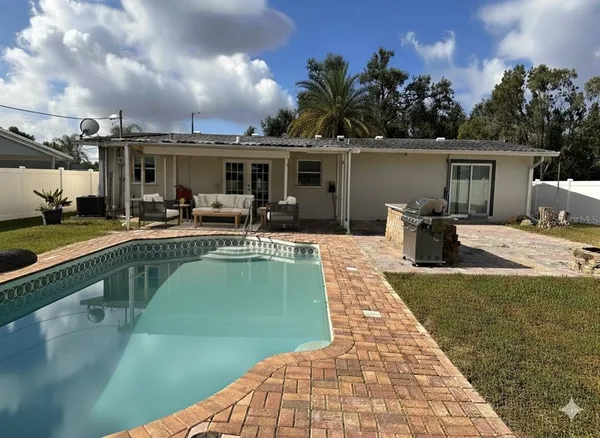 a view of a swimming pool with a patio