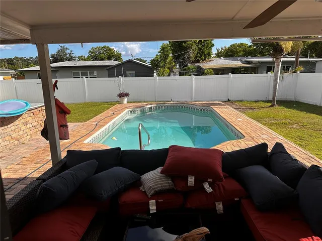 a view of a outdoor sitting area with furniture