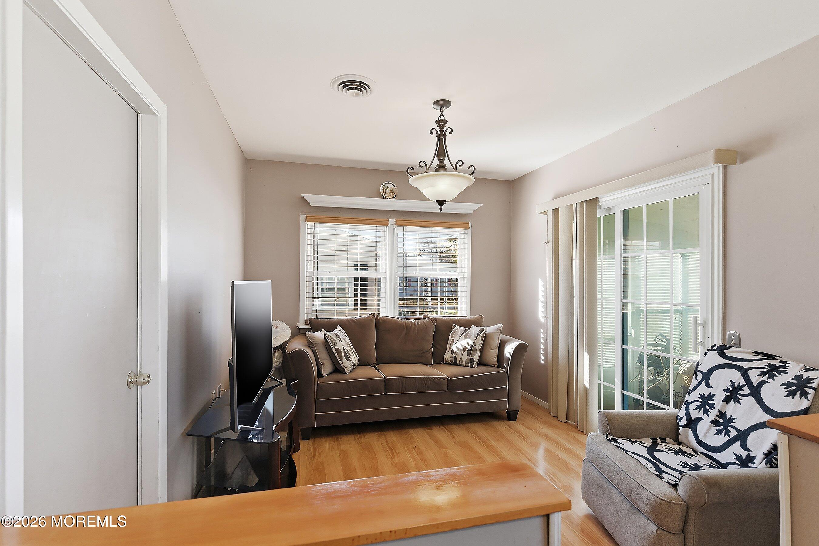 56 South Chestnut Avenue Whiting, NJ 08759 - Photo 12 of 44 a living room with furniture and a large window