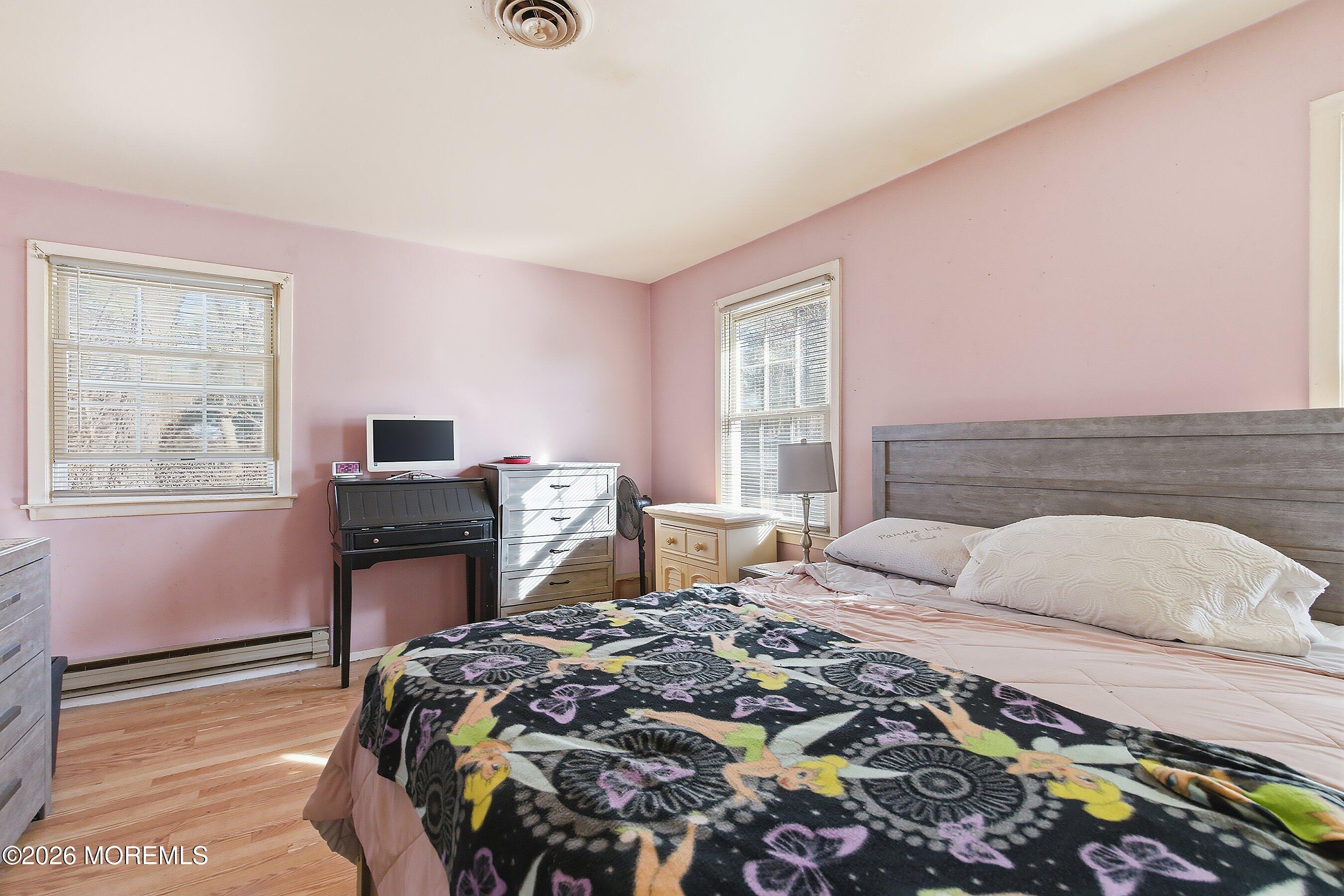 56 South Chestnut Avenue Whiting, NJ 08759 - Photo 21 of 44 a bedroom with a bed and a window