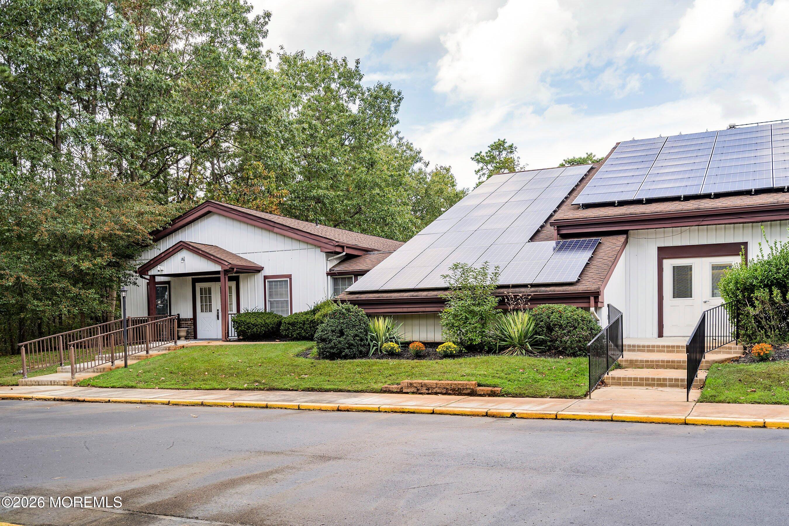 56 South Chestnut Avenue Whiting, NJ 08759 - Photo 30 of 44 a view of house with a yard and plants
