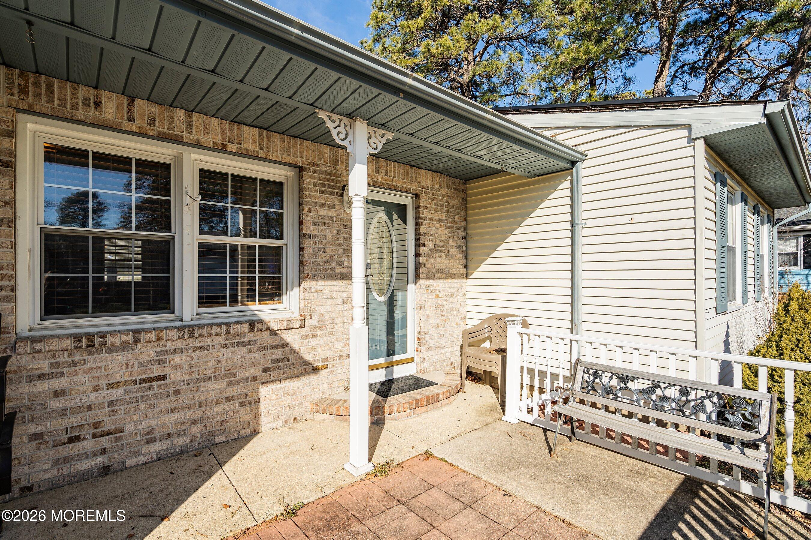 56 South Chestnut Avenue Whiting, NJ 08759 - Photo 3 of 44 a front view of a house with a sitting area