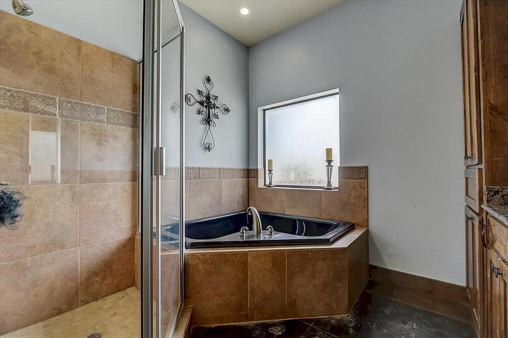 9494 Waide Road Sanger, TX 76266 - Photo 16 of 40 Bathroom featuring vanity and separate shower and tub