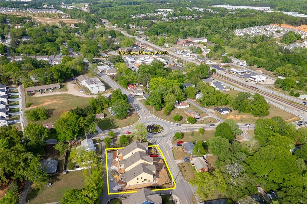 5812 Mitchell Street Flowery Branch, GA 30542 - Photo 5 of 8 an aerial view of residential house with outdoor space and parking