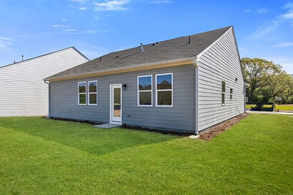 a view of front of house with a yard