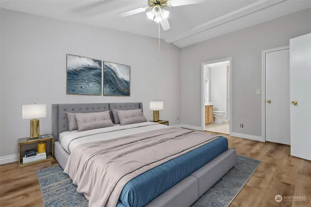a bedroom with bed and a chandelier
