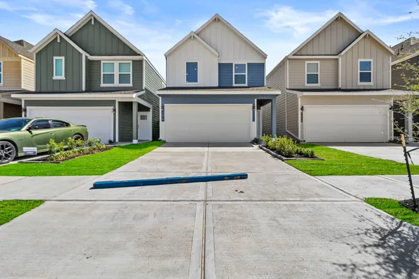 a house with a yard and a large parking space