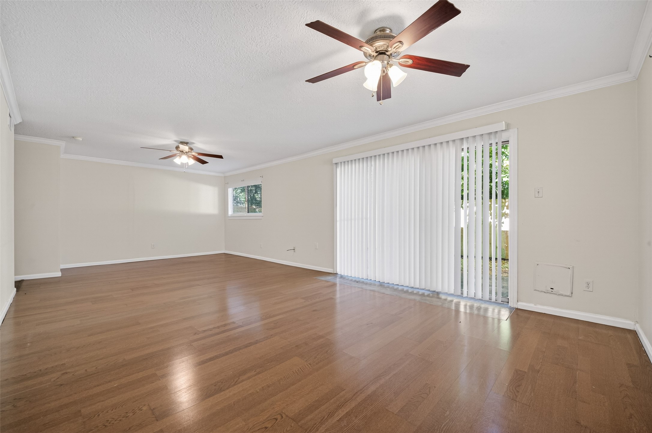 1106 East Red Cedar Circle Spring, TX 77380 - Photo 14 of 43 wooden floor in an empty room with a window