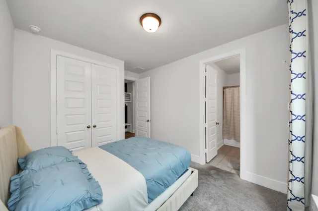 a bathroom with a sink a toilet a tub and shower