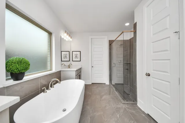 a bathroom with a sink double vanity and a mirror