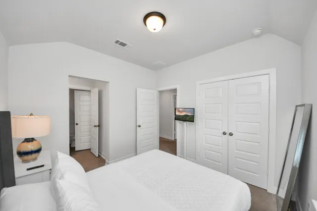 a bathroom with a toilet and bathtub