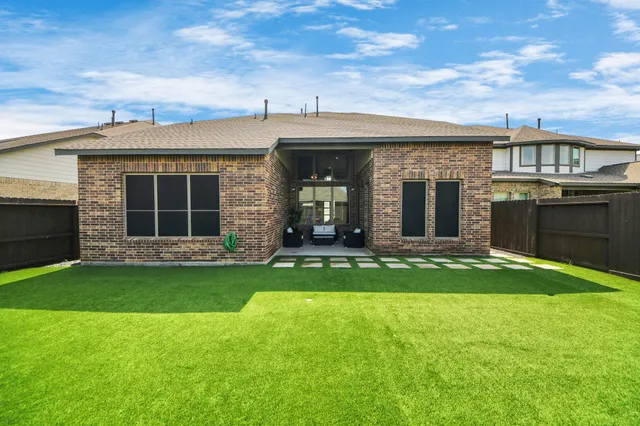 a view of garden with tall buildings