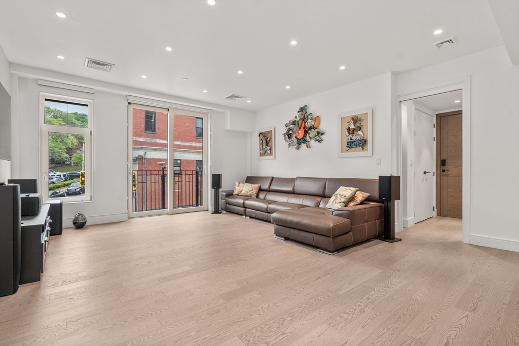 69 Walnut Street, Unit 4/5 Brookline, MA 02445 - Photo 11 of 26 a living room with furniture and a window