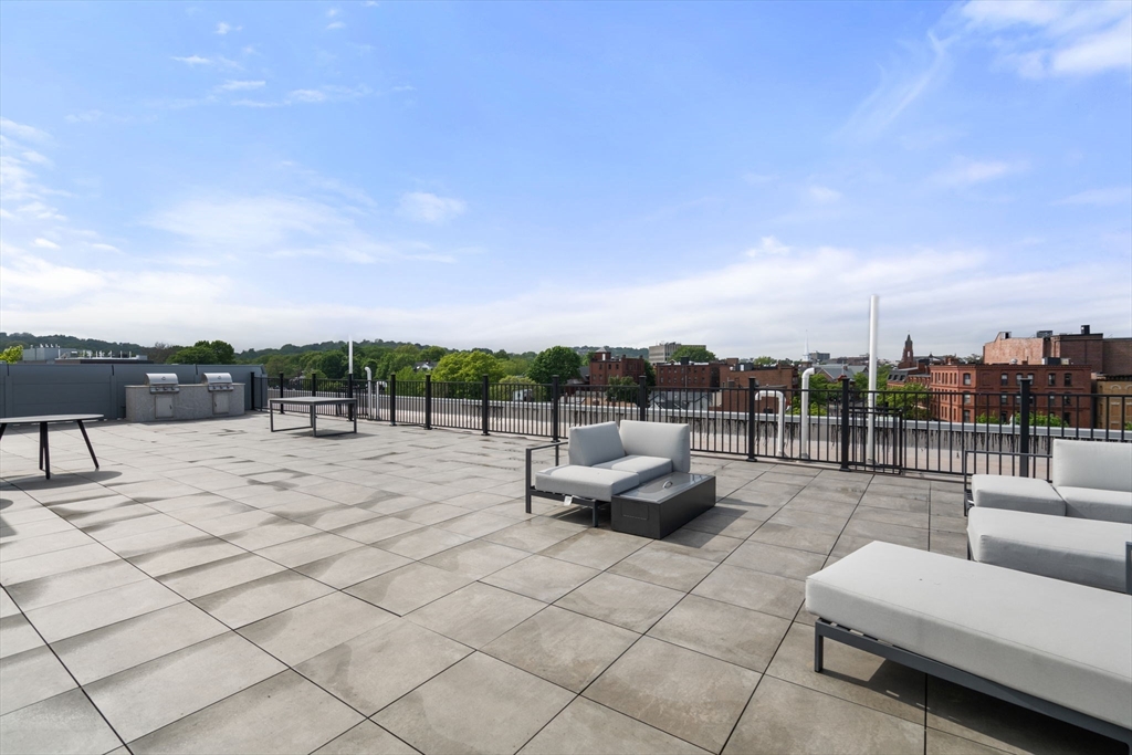 69 Walnut Street, Unit 4/5 Brookline, MA 02445 - Photo 20 of 26 a view of roof deck with couch and chairs