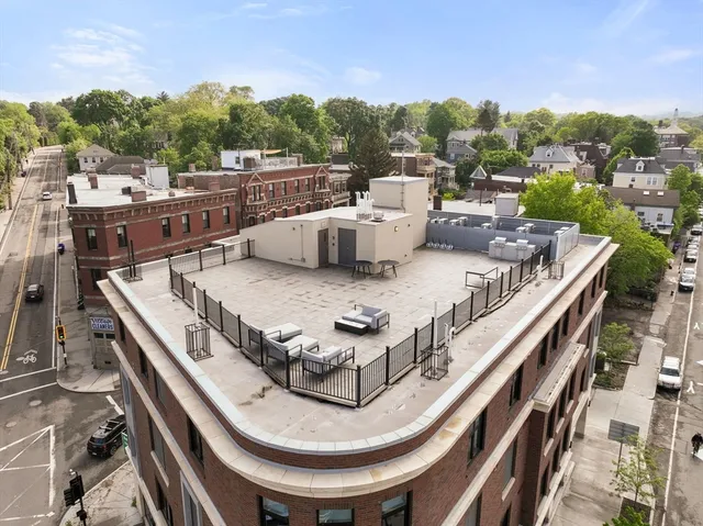a terrace with outdoor seating and city view