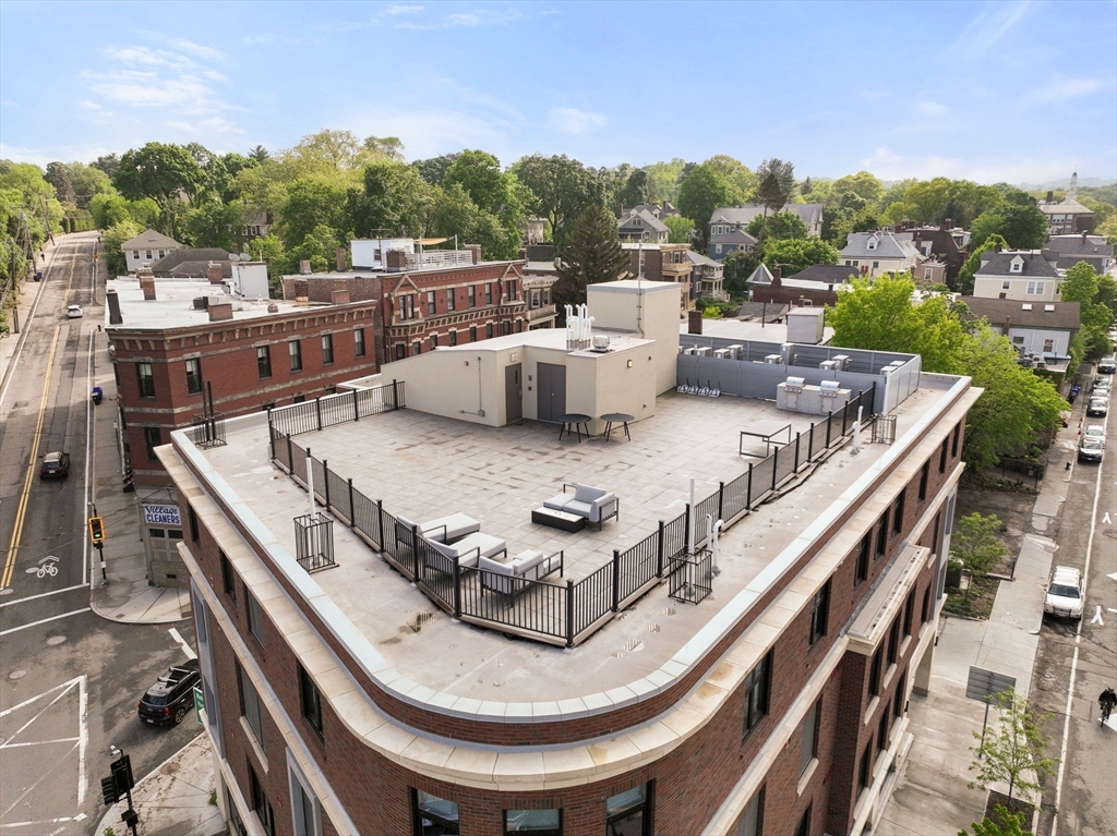 69 Walnut Street, Unit 4/5 Brookline, MA 02445 - Photo 21 of 26 a terrace with outdoor seating and city view