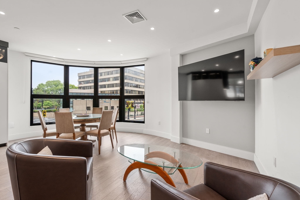 69 Walnut Street, Unit 4/5 Brookline, MA 02445 - Photo 7 of 26 a living room with furniture and a potted plant
