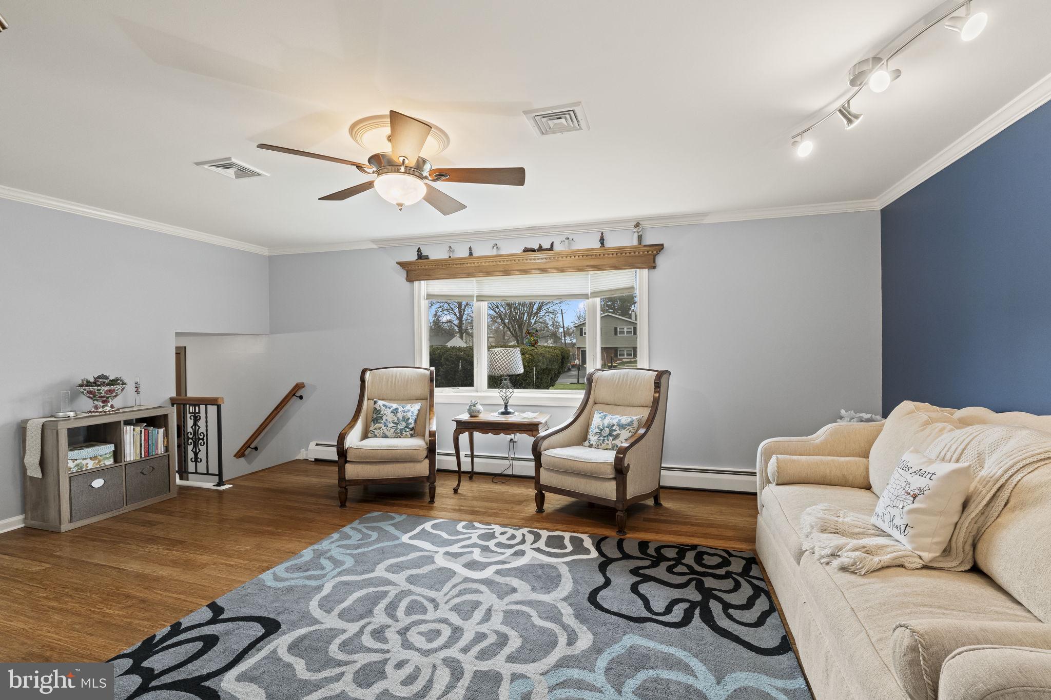 4901 Reedman Avenue Bensalem, PA 19020 - Photo 20 of 55 a living room with furniture a rug and a chandelier