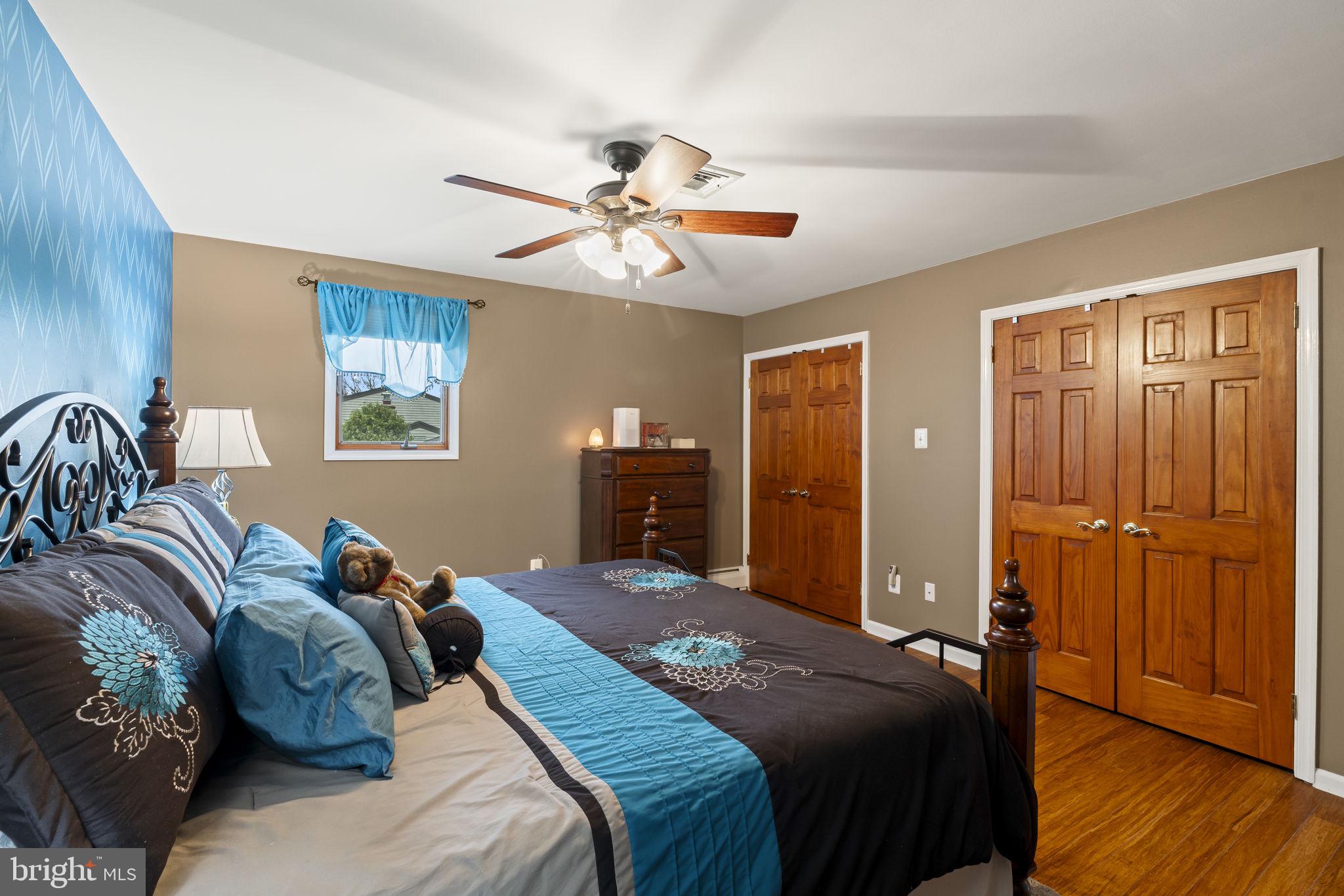 4901 Reedman Avenue Bensalem, PA 19020 - Photo 27 of 55 a bedroom with a bed and a chandelier