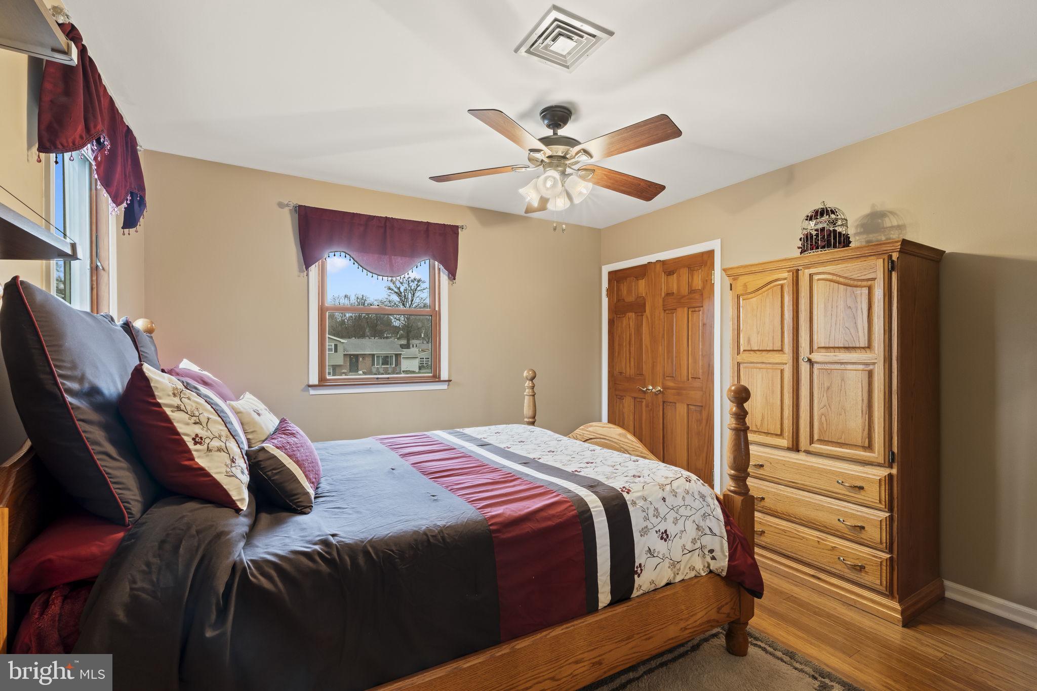 4901 Reedman Avenue Bensalem, PA 19020 - Photo 30 of 55 a bedroom with a bed dresser and a window