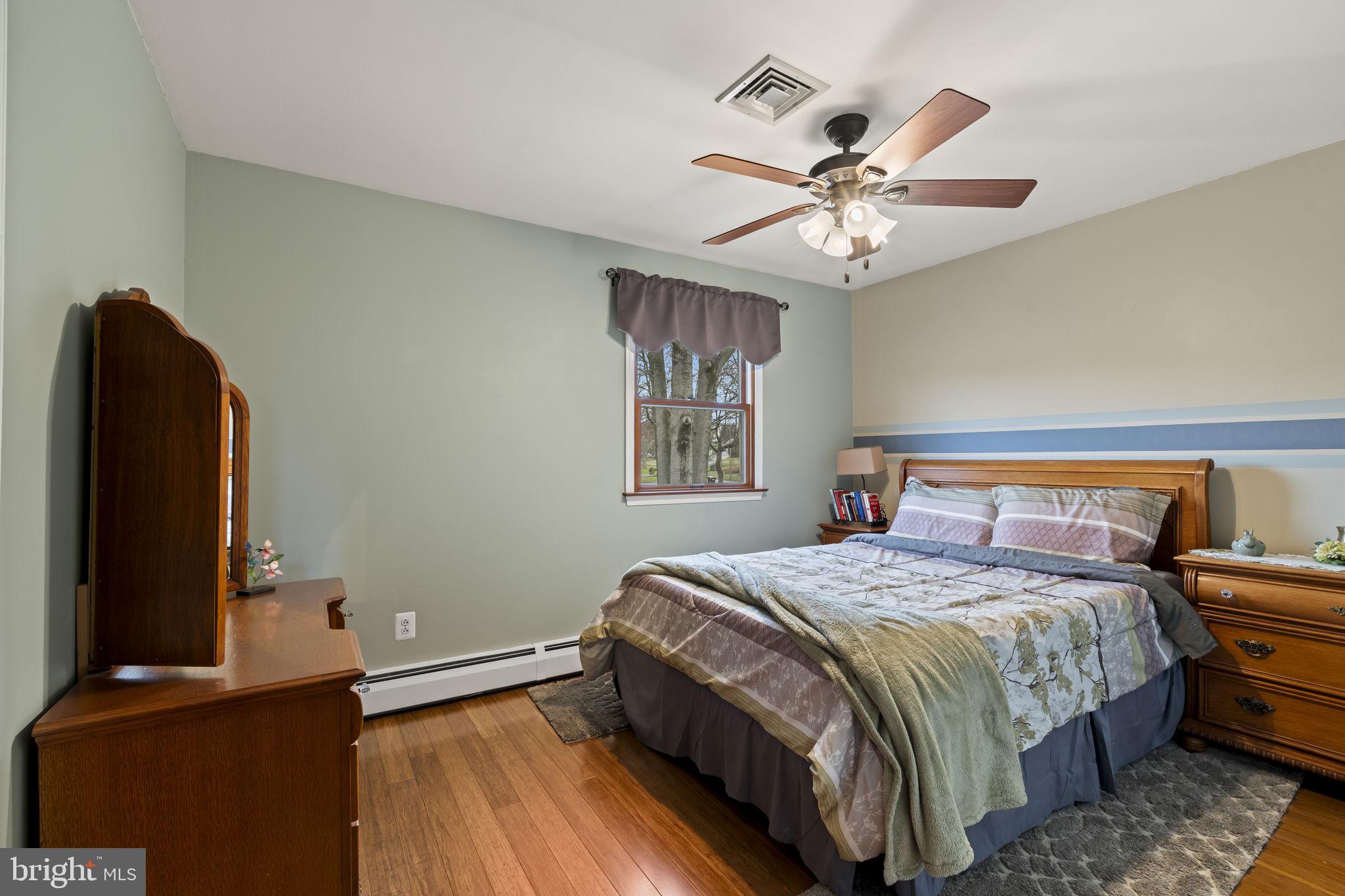 4901 Reedman Avenue Bensalem, PA 19020 - Photo 31 of 55 a bedroom with a bed and a chandelier
