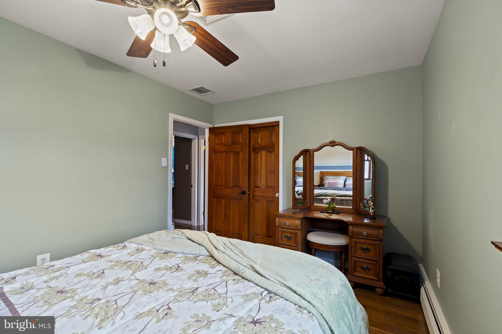 4901 Reedman Avenue Bensalem, PA 19020 - Photo 32 of 55 a bedroom with a bed and a chandelier