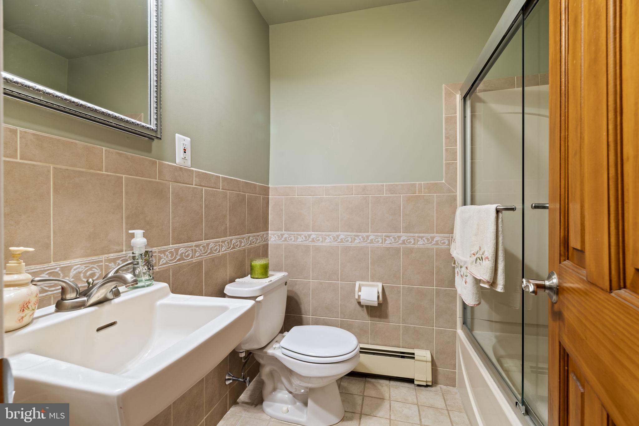 4901 Reedman Avenue Bensalem, PA 19020 - Photo 33 of 55 a bathroom with a sink toilet and shower