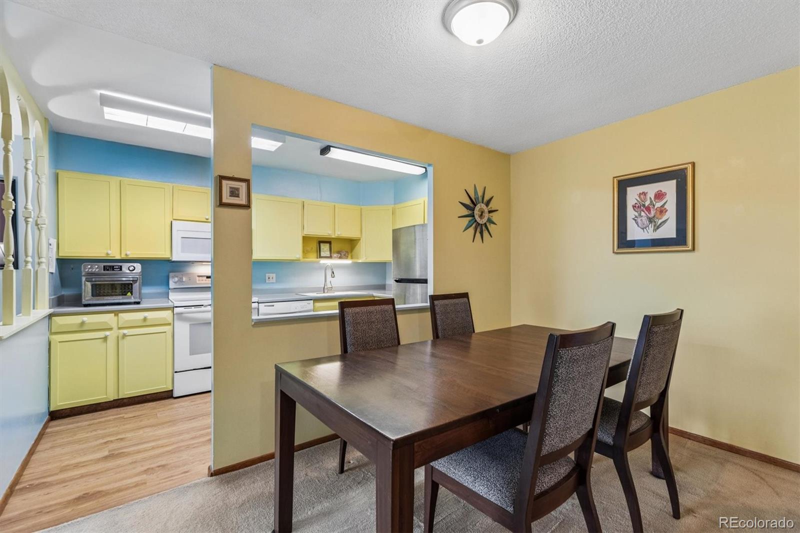 a kitchen with a table and chairs in it