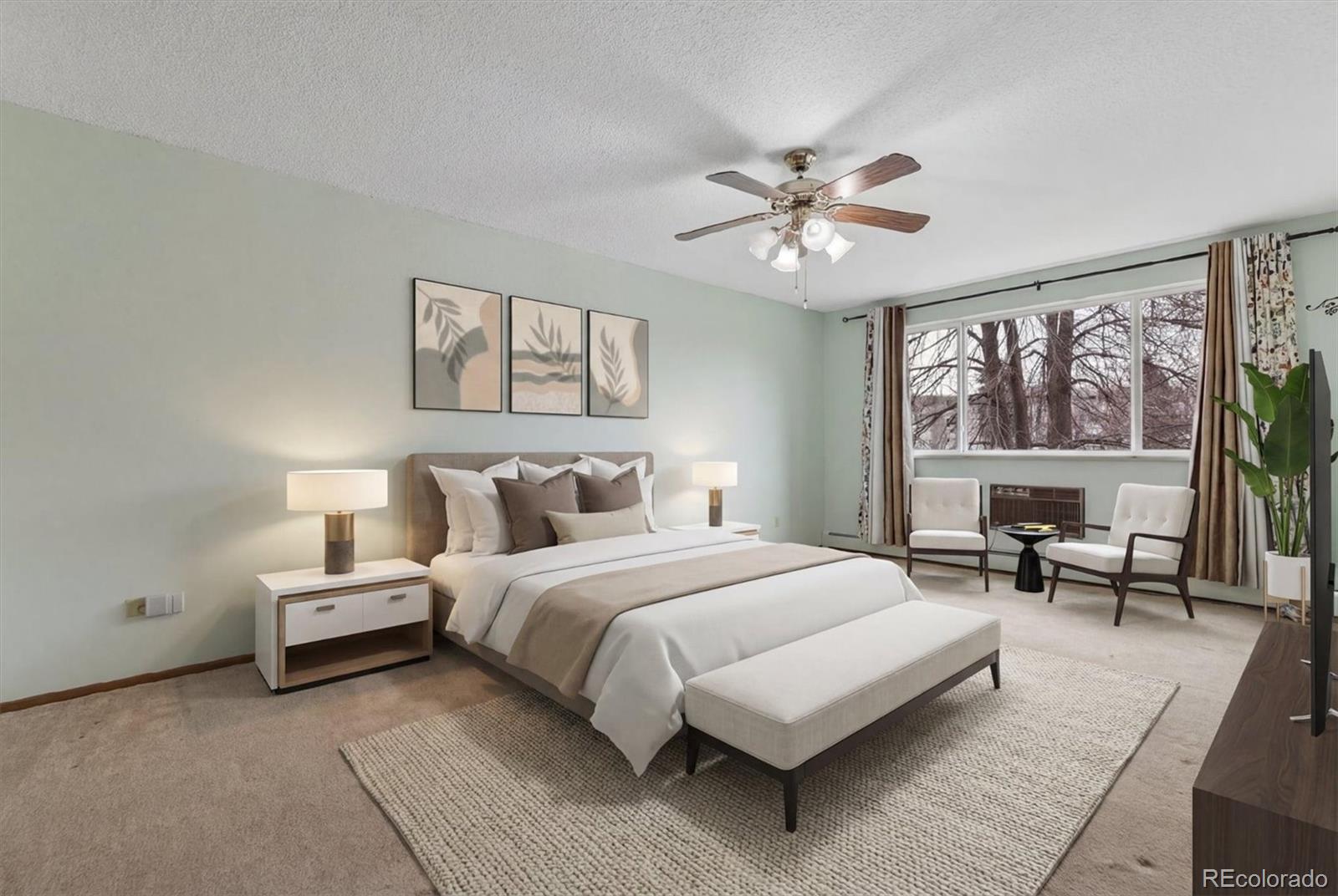 9155 Center Avenue, Unit 3B Denver, CO 80247 - Photo 11 of 50 a bedroom with a large bed and a window
